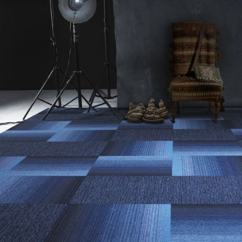 Blue carpet tiles offering flexible and modern flooring solutions.
