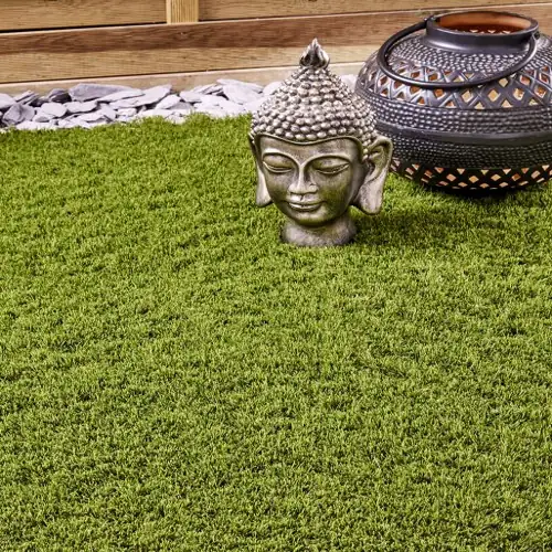 Cannes artificial grass carpet with elegant green hues and velvety texture.