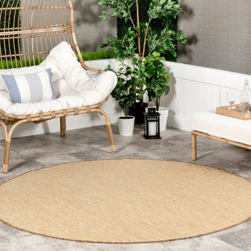 Dorinda Hazy solid rug with subtle texture, suitable for indoor and outdoor spaces.