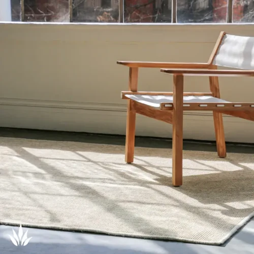 EarthSISAL natural sisal carpet in soft beige tones, styled under minimalist wooden furniture in a Dubai sunlit room for a calm, organic ambiance.