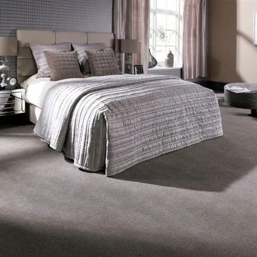 Fluffy carpet flooring creating a relaxing vibe in a cozy bedroom.
