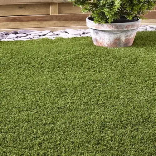 Lisbon artificial grass carpet with soft green fibers and realistic finish.