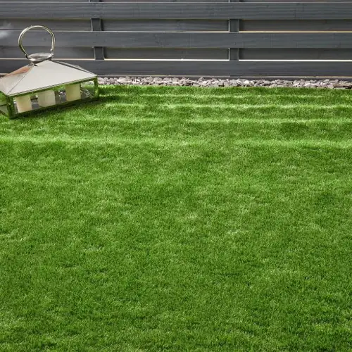 Lucerne artificial grass carpet with alpine green tones and dense, realistic texture