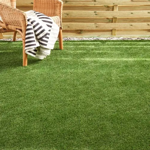 Oasis artificial grass carpet with vibrant greenery and soft, durable turf.