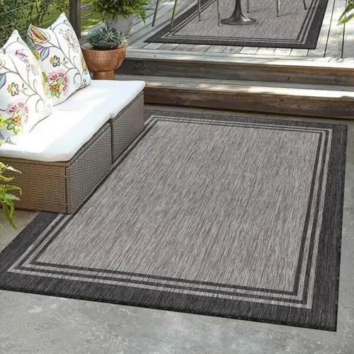 Outdoor carpet enhancing cozy balcony setup