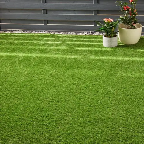 Porto artificial grass carpet with deep green tones and dense, natural-looking pile.
