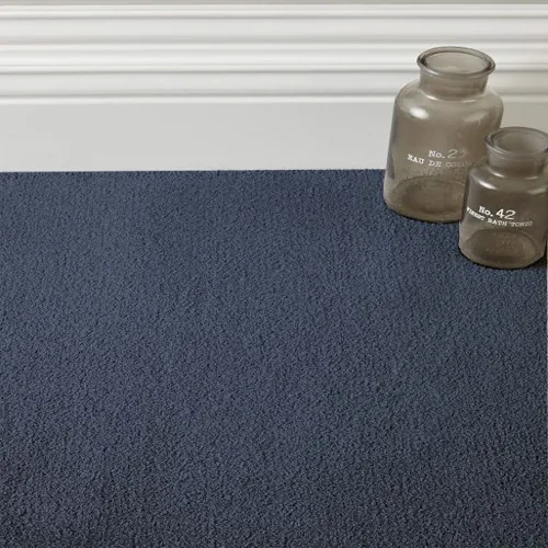 Rhodes Blue Carpet showcasing elegant mid-blue tones with a refined texture, ideal for creating a stylish and serene ambiance in contemporary interiors.