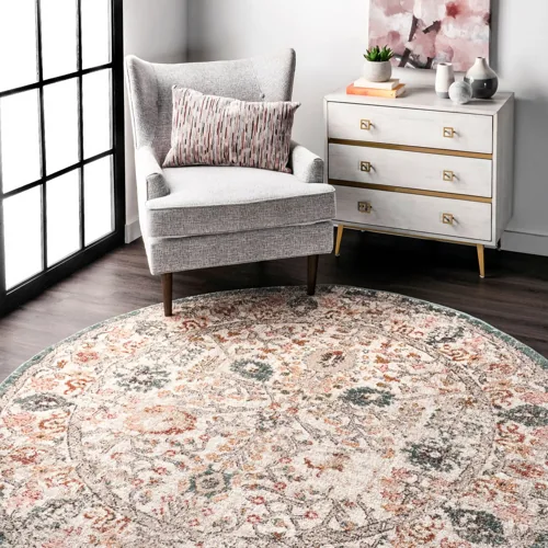 Round rug from the Native Collage collection with textured weave and cultural motifs.