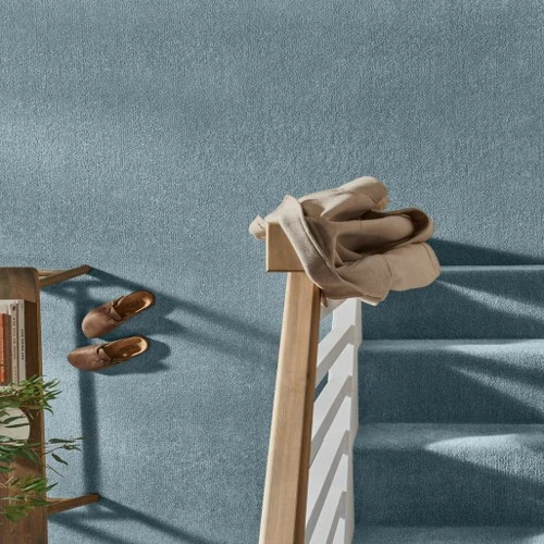 Stylish teal carpet featuring a perfect blend of blue and green tones, ideal for adding a vibrant yet calming touch to contemporary interiors in both residential and commercial spaces.