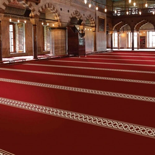 Traditional mosque carpet designed for comfort and prayer alignment.