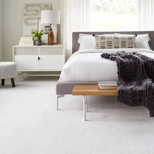 Warm carpet flooring transforming your bedroom into a comfort zone.