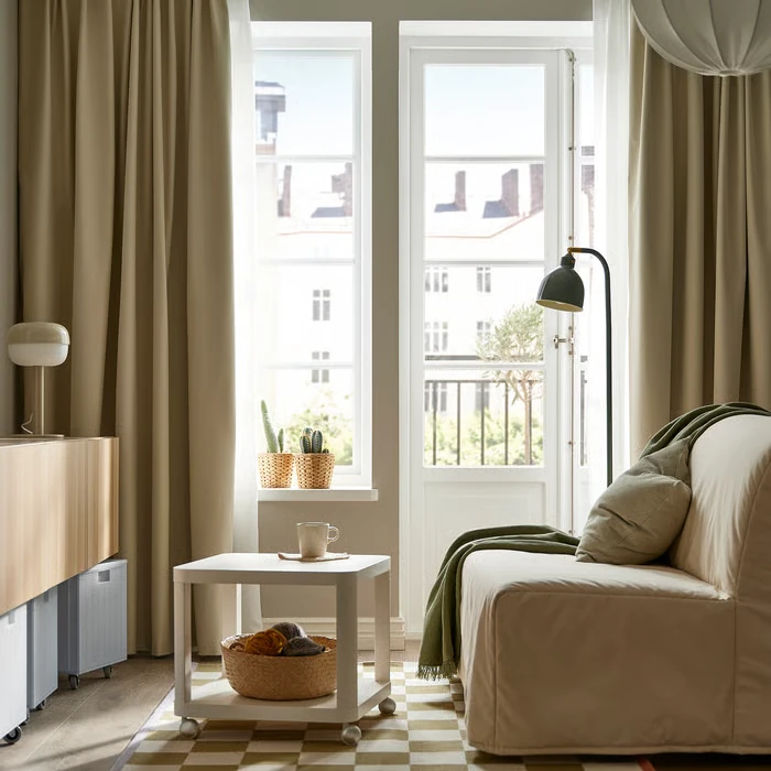Beige living room curtains for privacy and light.