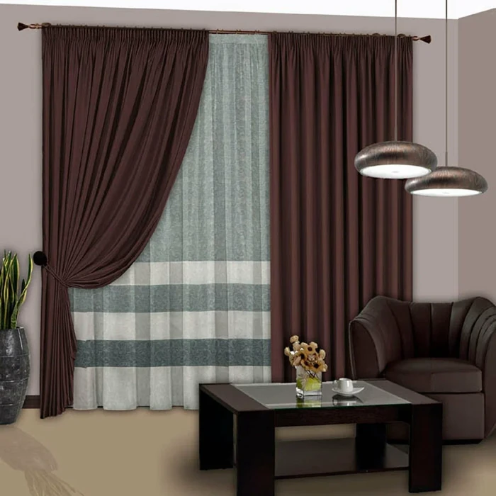 Brown blackout curtains with striped sheer overlay.