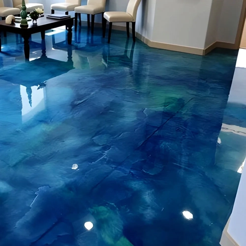 Close-up of a broadcast epoxy floor, showing decorative flakes or aggregates evenly distributed across the surface