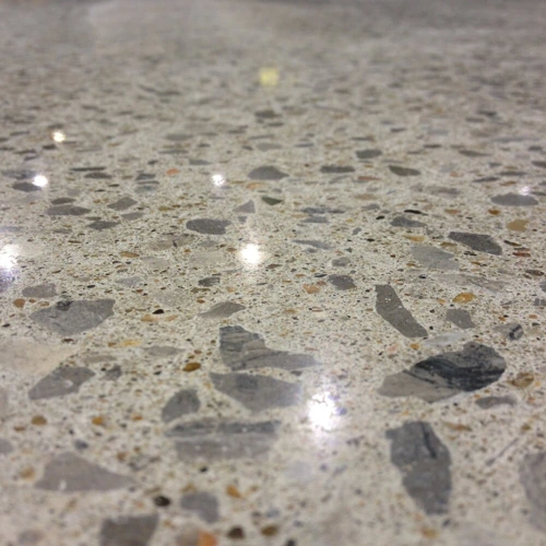 Decorative epoxy flooring showcasing a unique artistic pattern with swirling colors and a high-gloss finish.