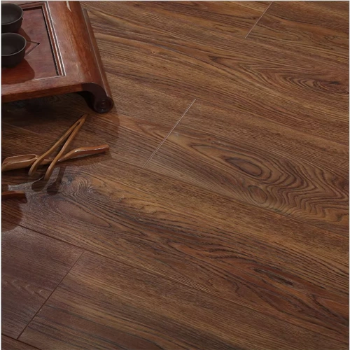 Embossed laminate flooring with a realistic wood grain texture.