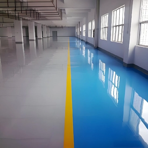 Garage floor coated with a light gray water-based epoxy, displaying a smooth, semi-gloss finish that's a more environmentally friendly choice.