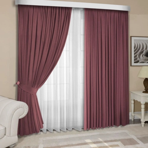 Living room with maroon curtains and white sheers.