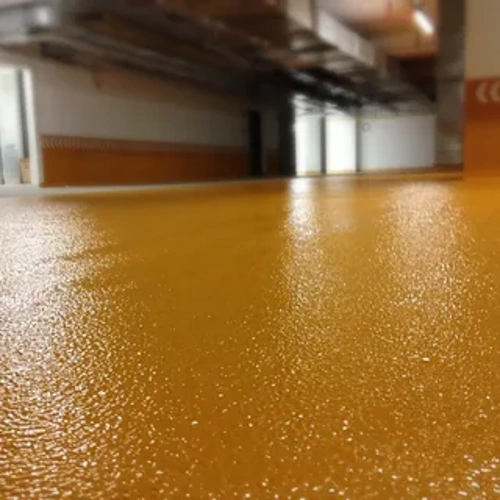 Matte epoxy flooring providing a non-glossy, subtle finish that minimizes reflections and offers a modern aesthetic.