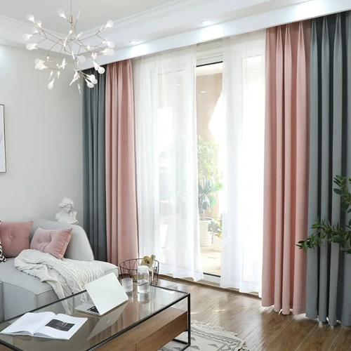 Modern living room with pink and gray curtains.