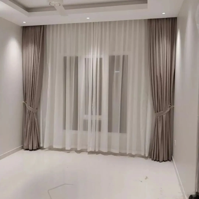 Motorized curtains installed in a Dubai smart home interior