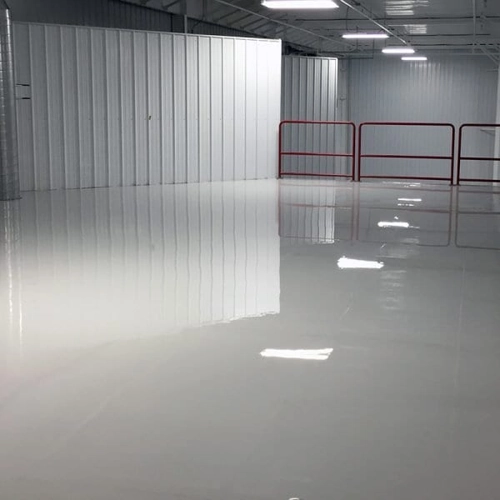 Reflective epoxy flooring in a Dubai enhancing lighting and aesthetics.