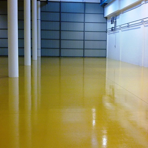 Standard epoxy floor coating in a Dubai warehouse offering durable and cost-effective surface protection