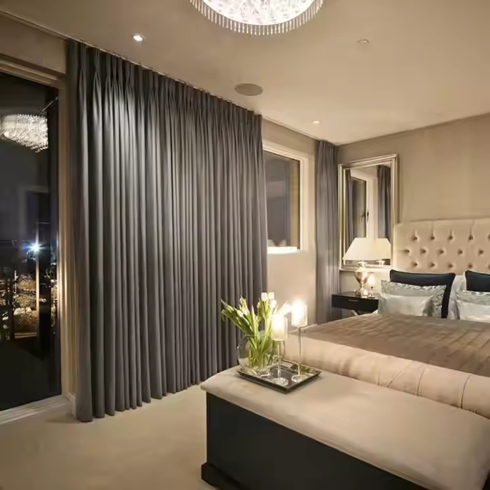 lush grey curtains for privacy in a stylish bedroom.