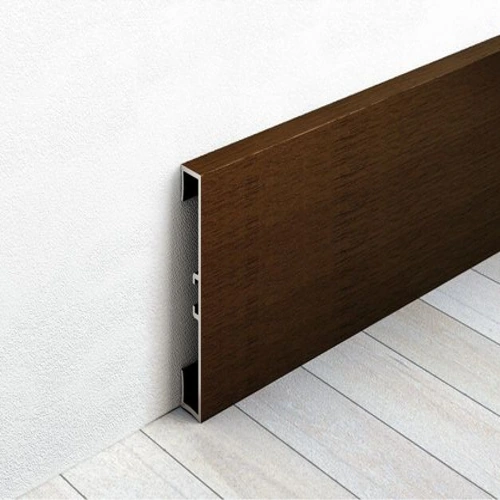 Dark brown aluminum skirting with a modern, flat profile against a white wall and light wood floor