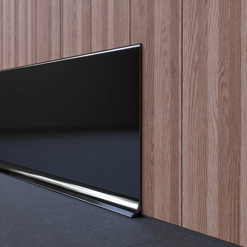 Glossy black skirting with sleek chrome top and bottom edges, set against a modern wood-paneled wall.
