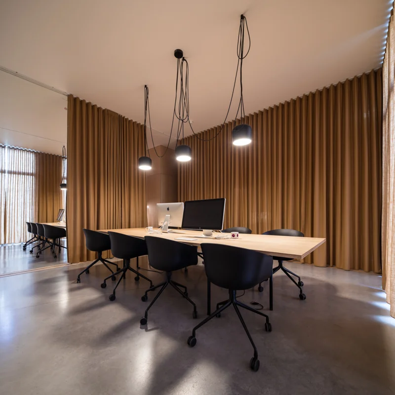 Layered office curtains – combine sheer and blackout layers for versatile light control in workspaces.