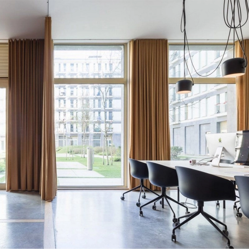 Modern office with brown silk curtains.